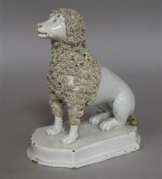 An early 19th century pearlware poodle with bone